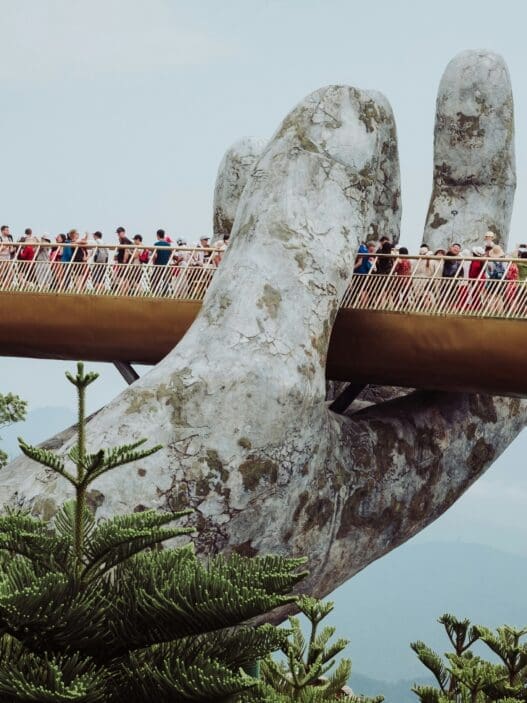 a bridge with a large hand holding a bridge