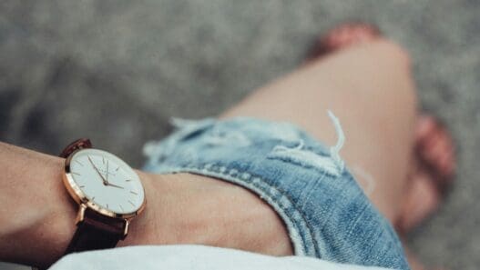a wrist watch on a person's wrist