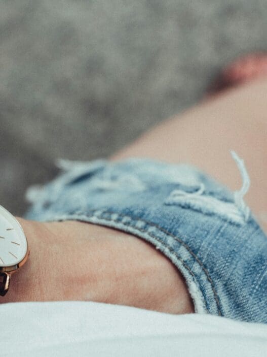 a wrist watch on a person's wrist