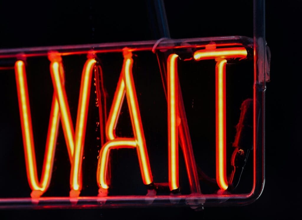 a neon sign with red letters