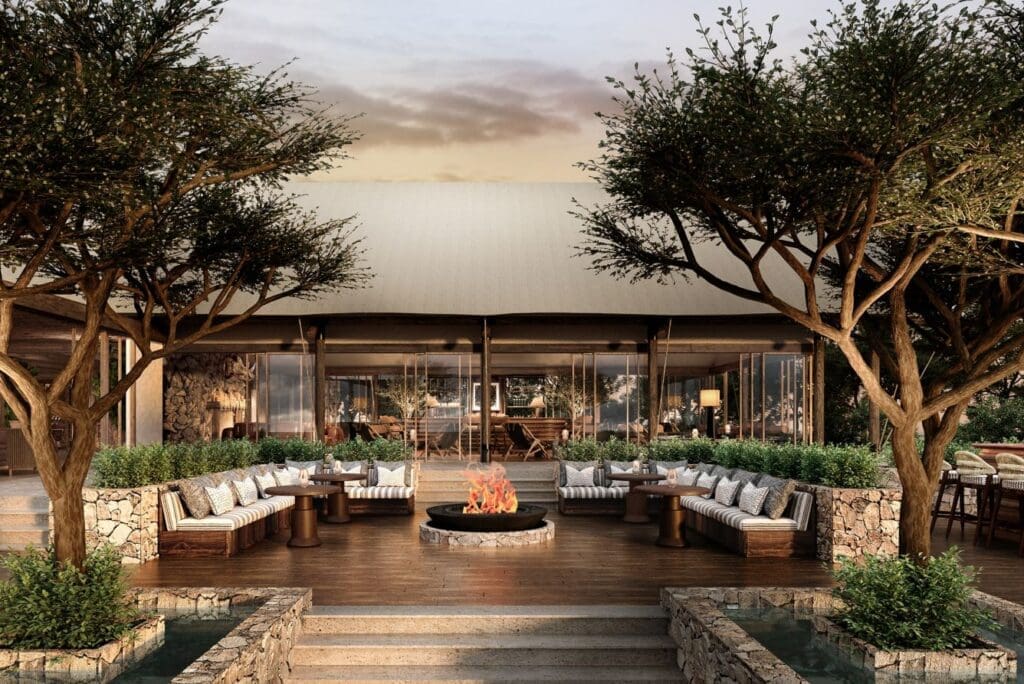 a patio with a fire pit and trees