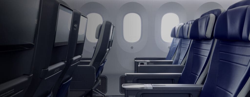 seats in an airplane with windows