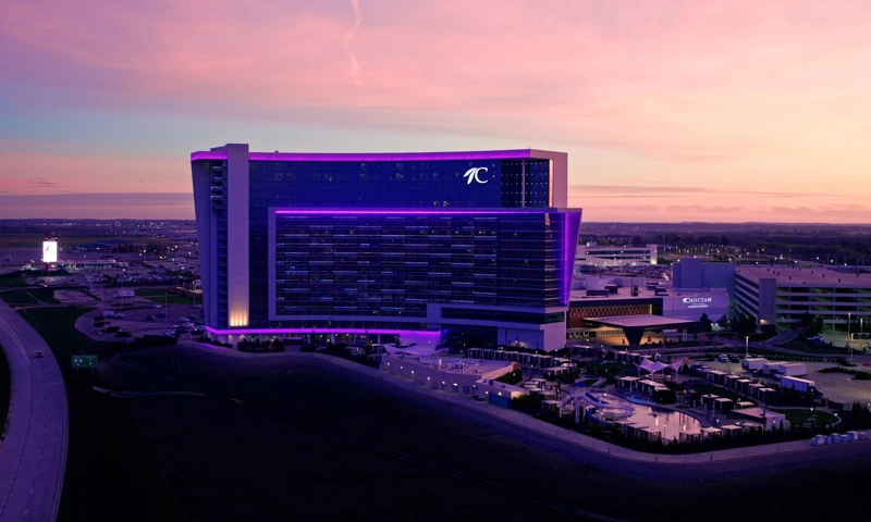 a large building with purple lights