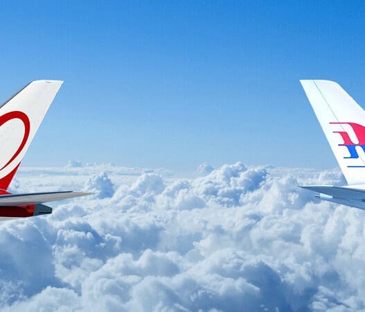 two planes flying above the clouds