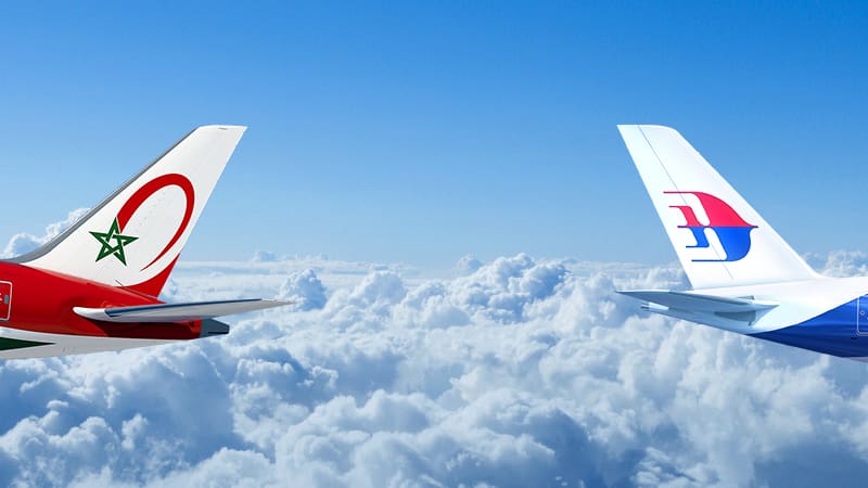 two planes flying above the clouds