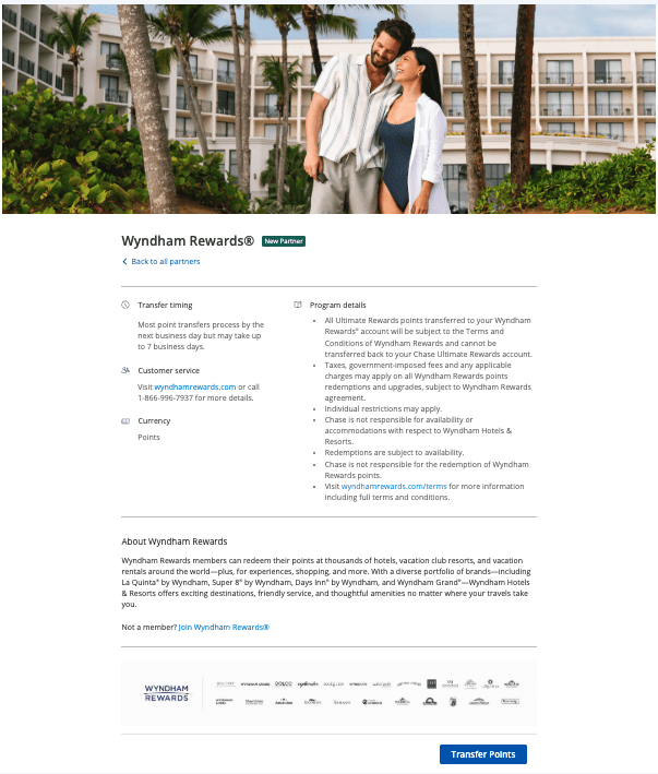 a man and woman standing in front of a hotel