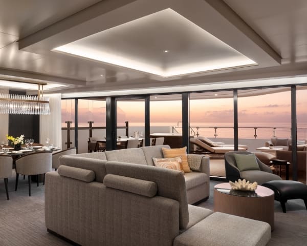 a living room with a couch and chairs