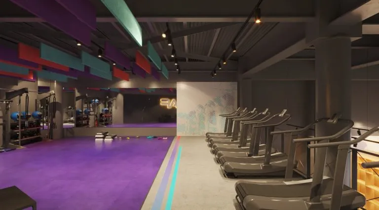 a gym with treadmills and exercise equipment