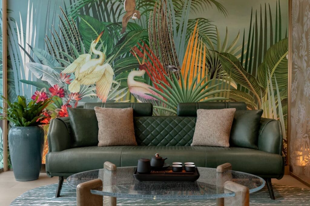 a couch in a room with a wall mural