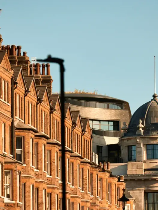 a row of brick buildings with a dome top