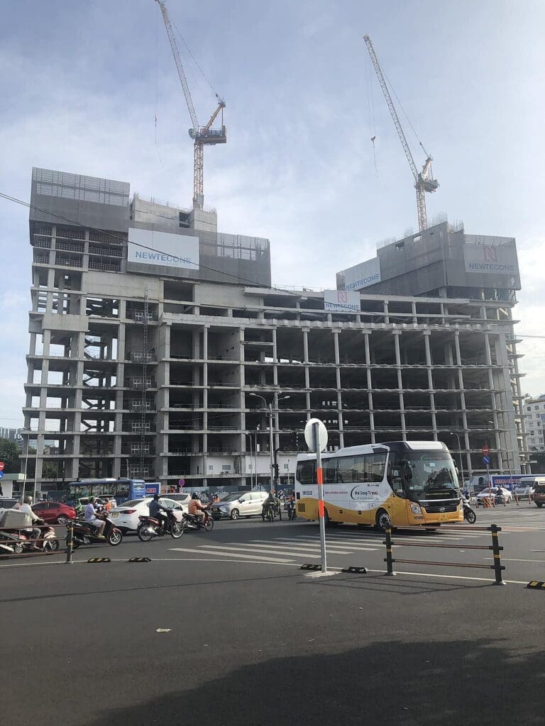 a building under construction with a lot of cranes