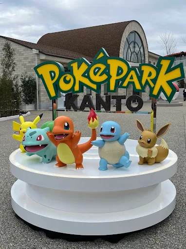 a group of cartoon characters on a white platform