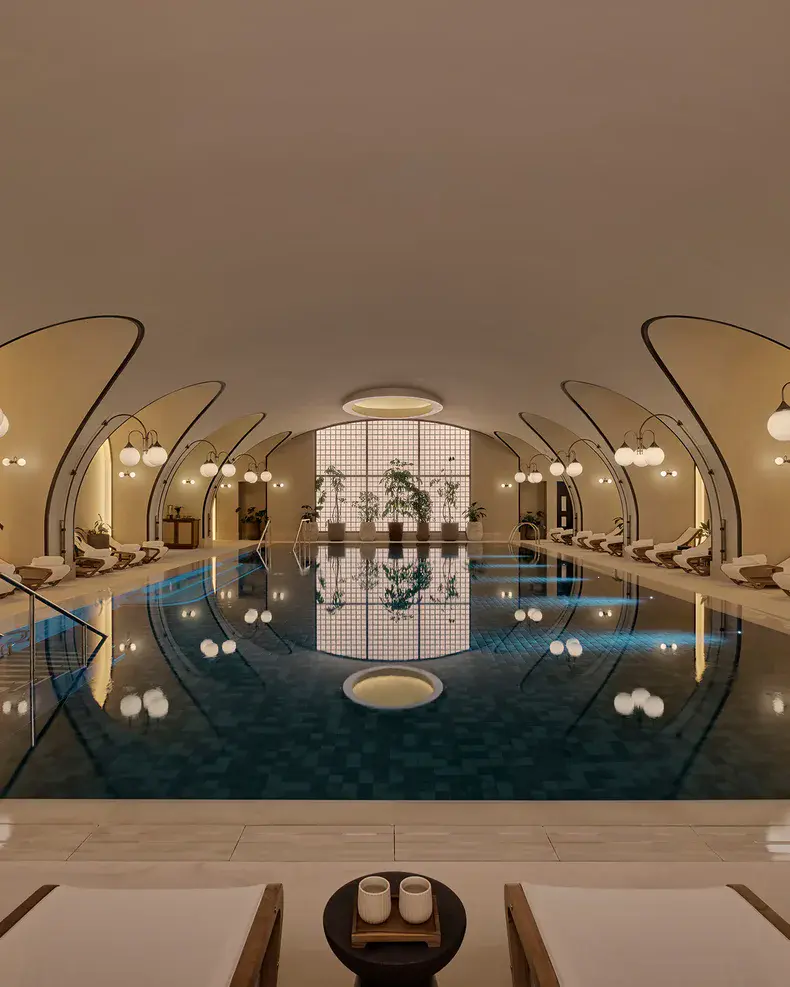 a indoor pool with chairs and a plant