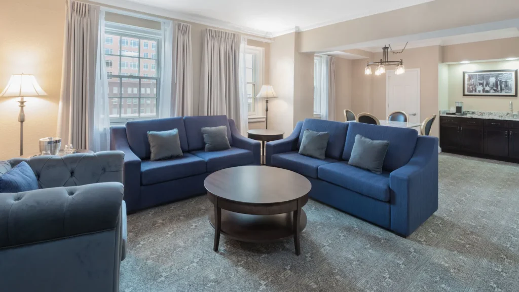 a living room with couches and a table