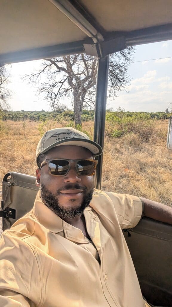 a man in a hat and sunglasses