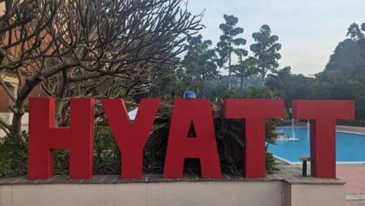 a large red sign on a wall