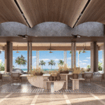 a room with a large table and chairs and a large window