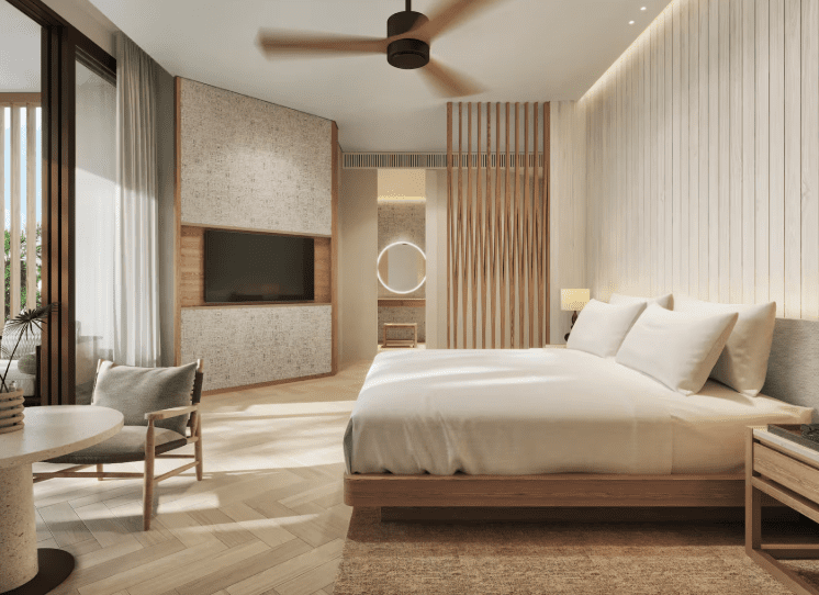 a bedroom with a bed and a tv