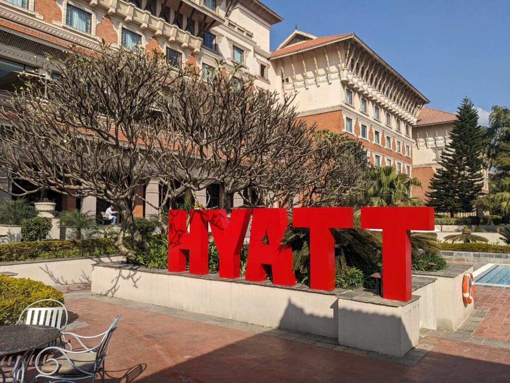 a large red sign in front of a building