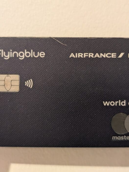 a hand holding a credit card