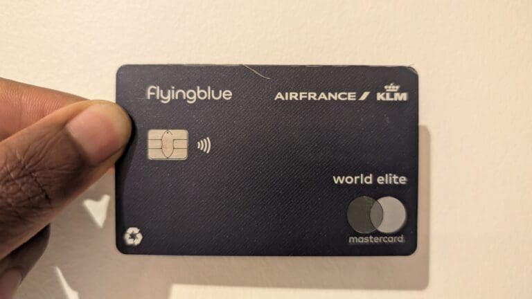 a hand holding a credit card