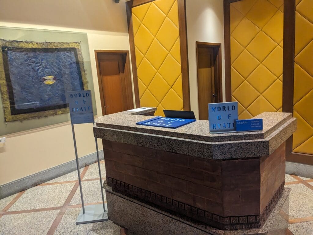 a reception desk with signs on it