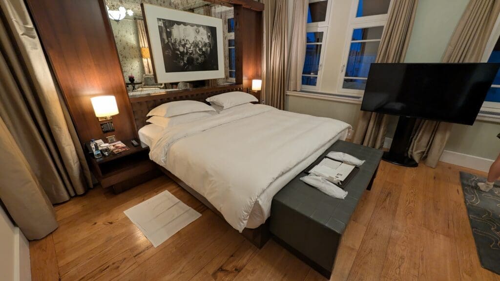 a bed with a mirror above it