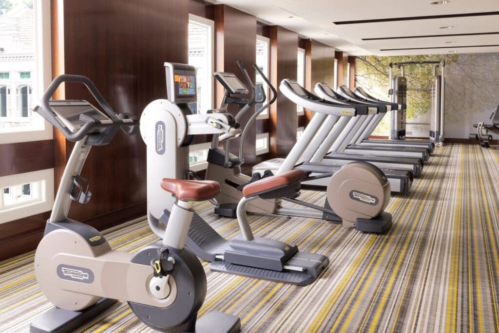 a group of exercise machines in a room