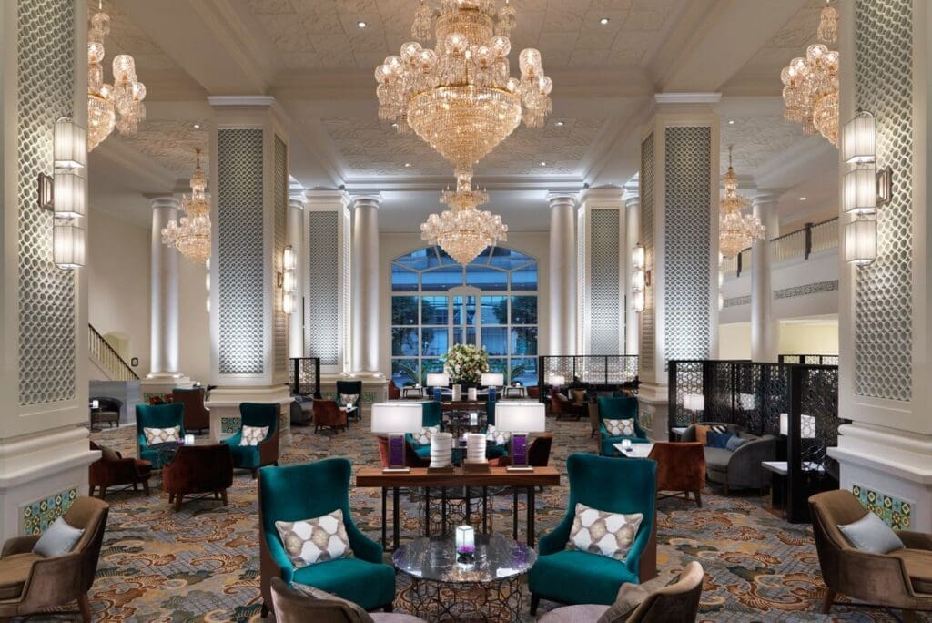 a room with a chandelier and chairs