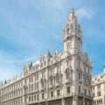 a large white building with a tower