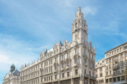 a large white building with a tower