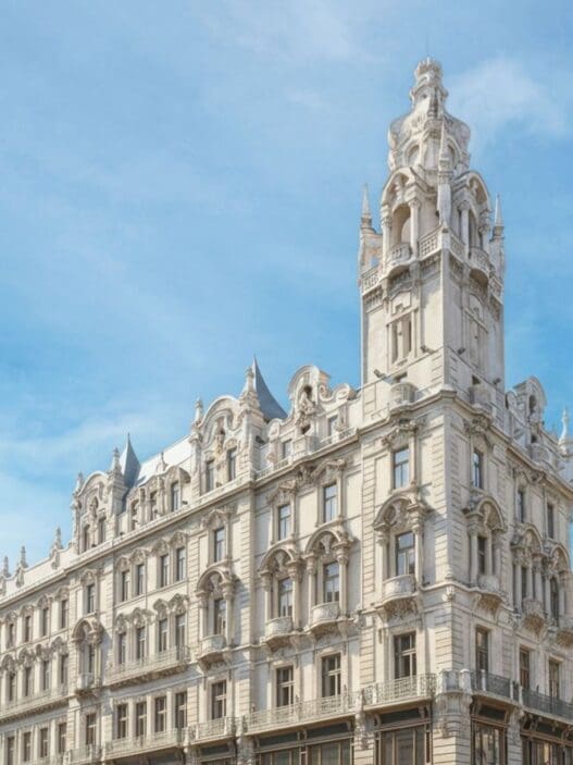 a large white building with a tower