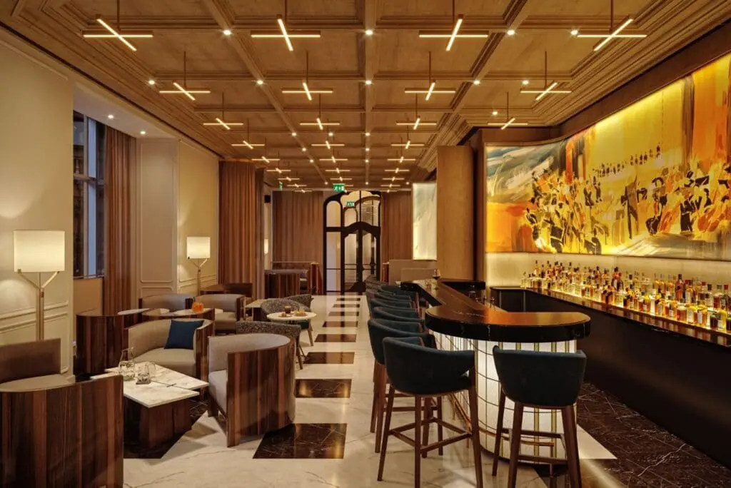 a room with a bar and chairs