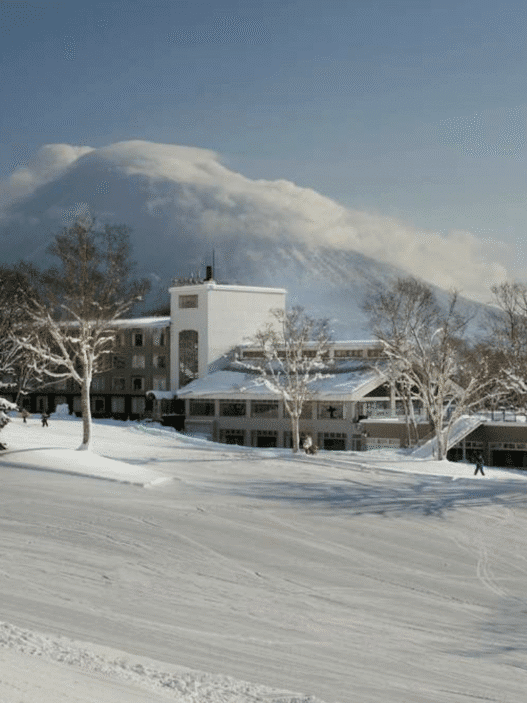 a building with snow on the ground
