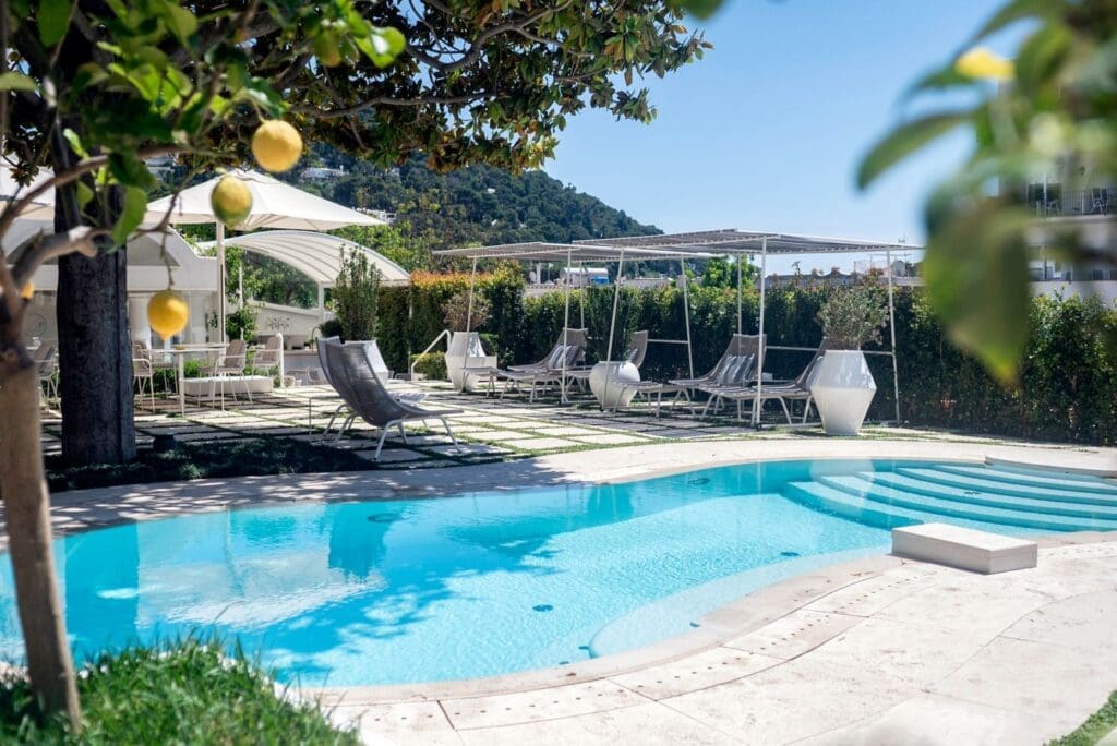 a pool with chairs and umbrellas