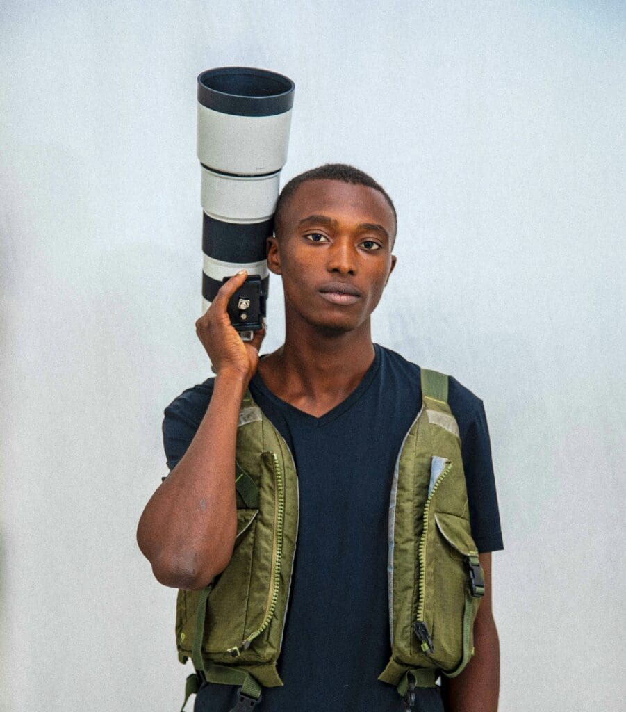 a man holding a large camera