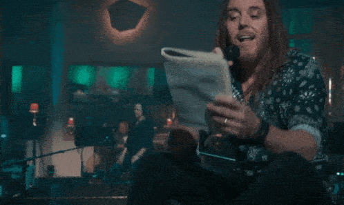 a man singing into a microphone