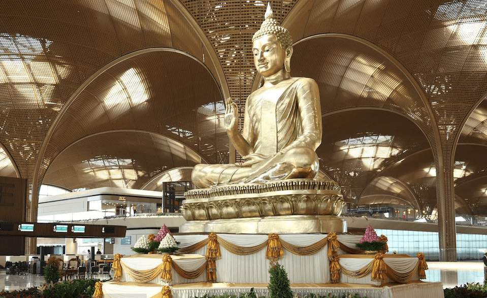 a large gold statue in a building