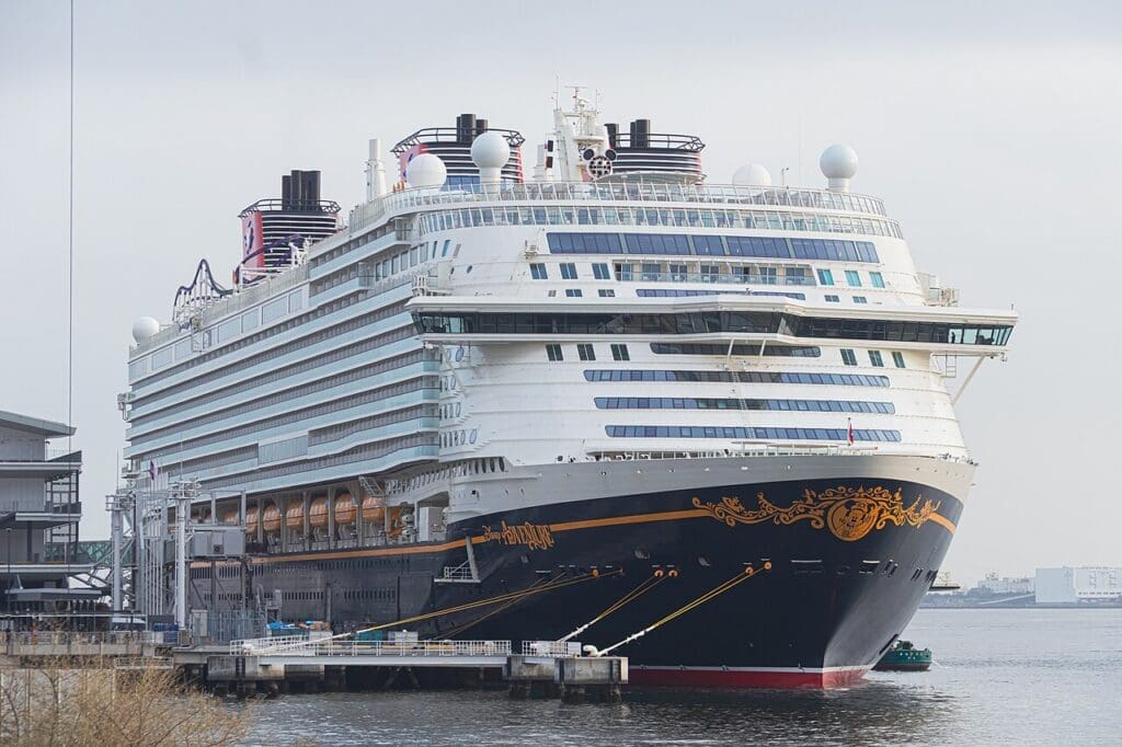 a large cruise ship docked at a dock
