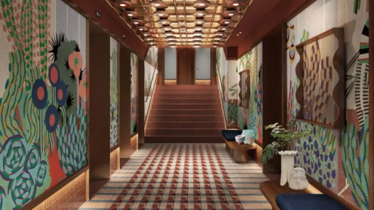 a staircase with art on the wall