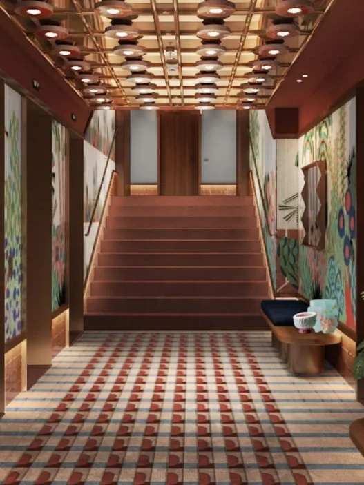 a staircase with art on the wall