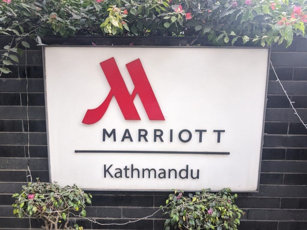 a sign on a brick wall