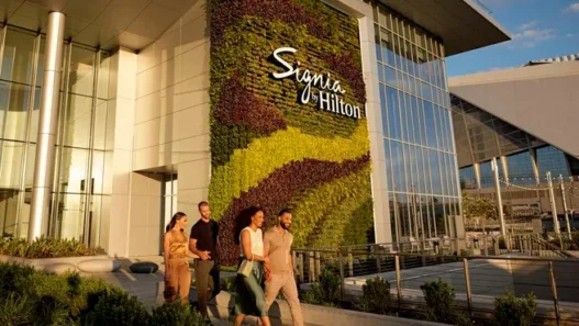 a group of people walking in front of a building