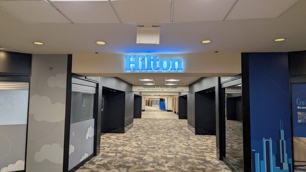 a hallway with blue sign