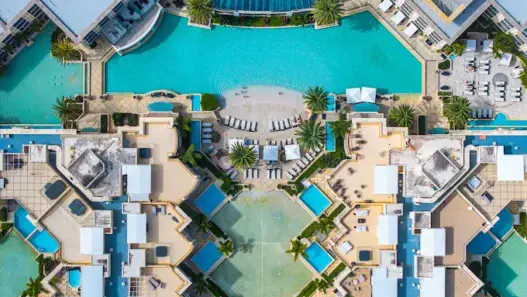 a swimming pool with a pool in the middle of it