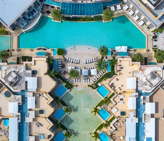 a swimming pool with a pool in the middle of it