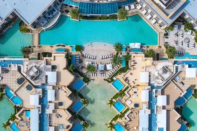 a swimming pool with a pool in the middle of it