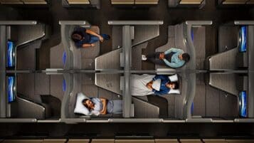 people sitting in a row of seats