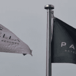 a black and white flag on a pole