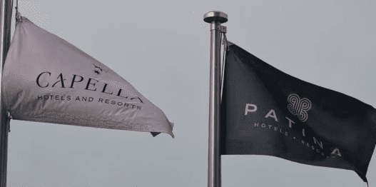 a black and white flag on a pole